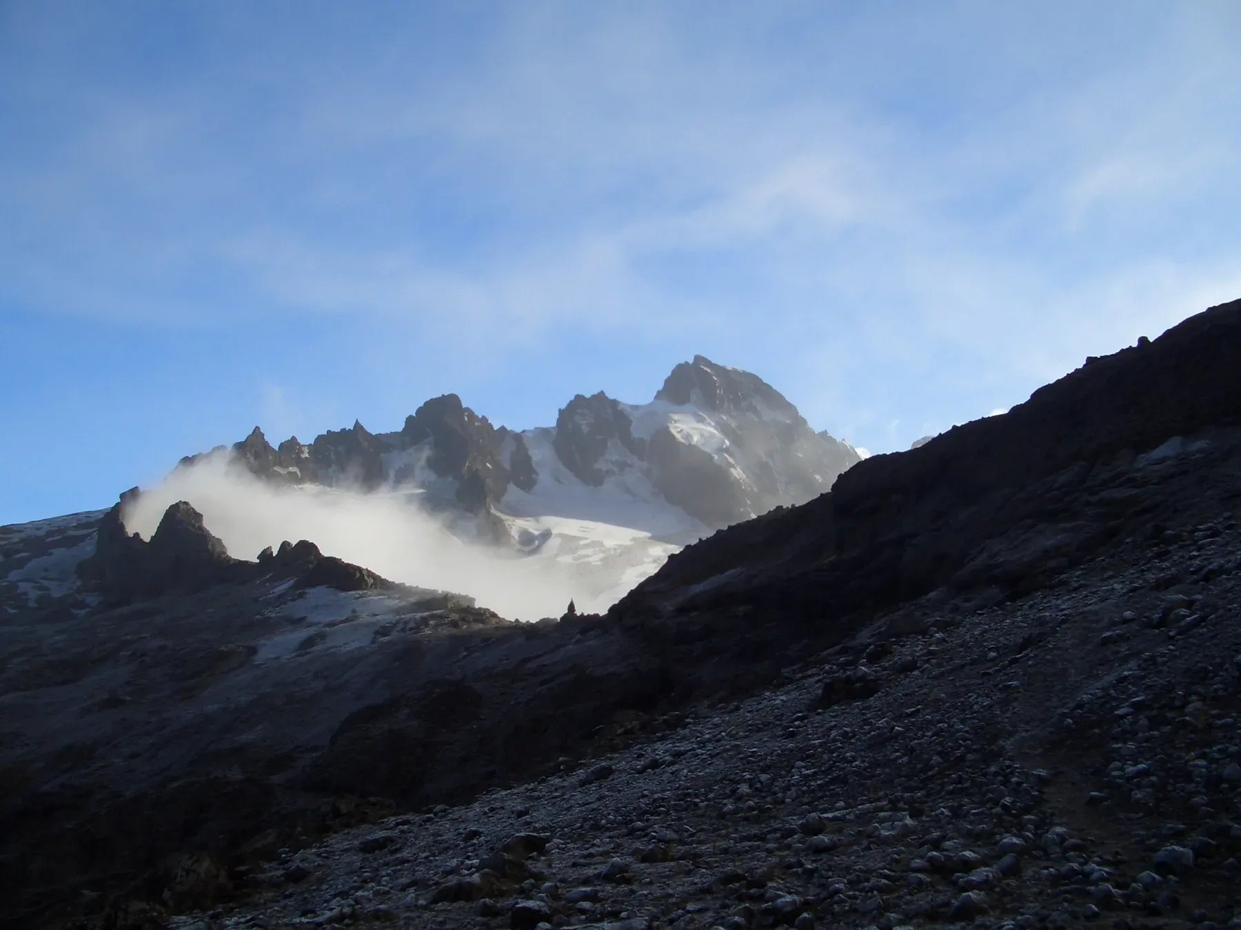 Jagged, cloud-wrapped summits in El Altar's volcanic amphitheatre in Ecuador.