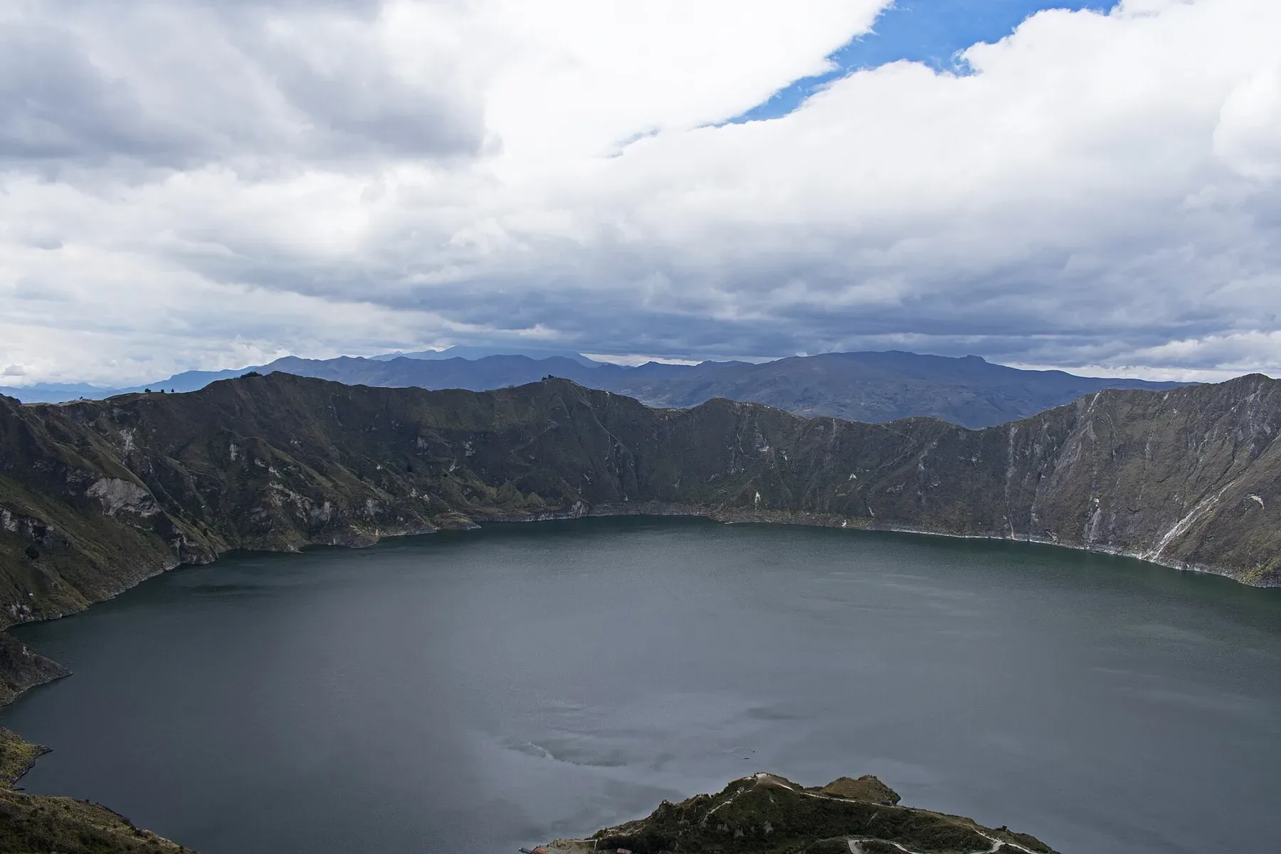 Quilotoa's crater lake viewed from its high rim in Ecuador.