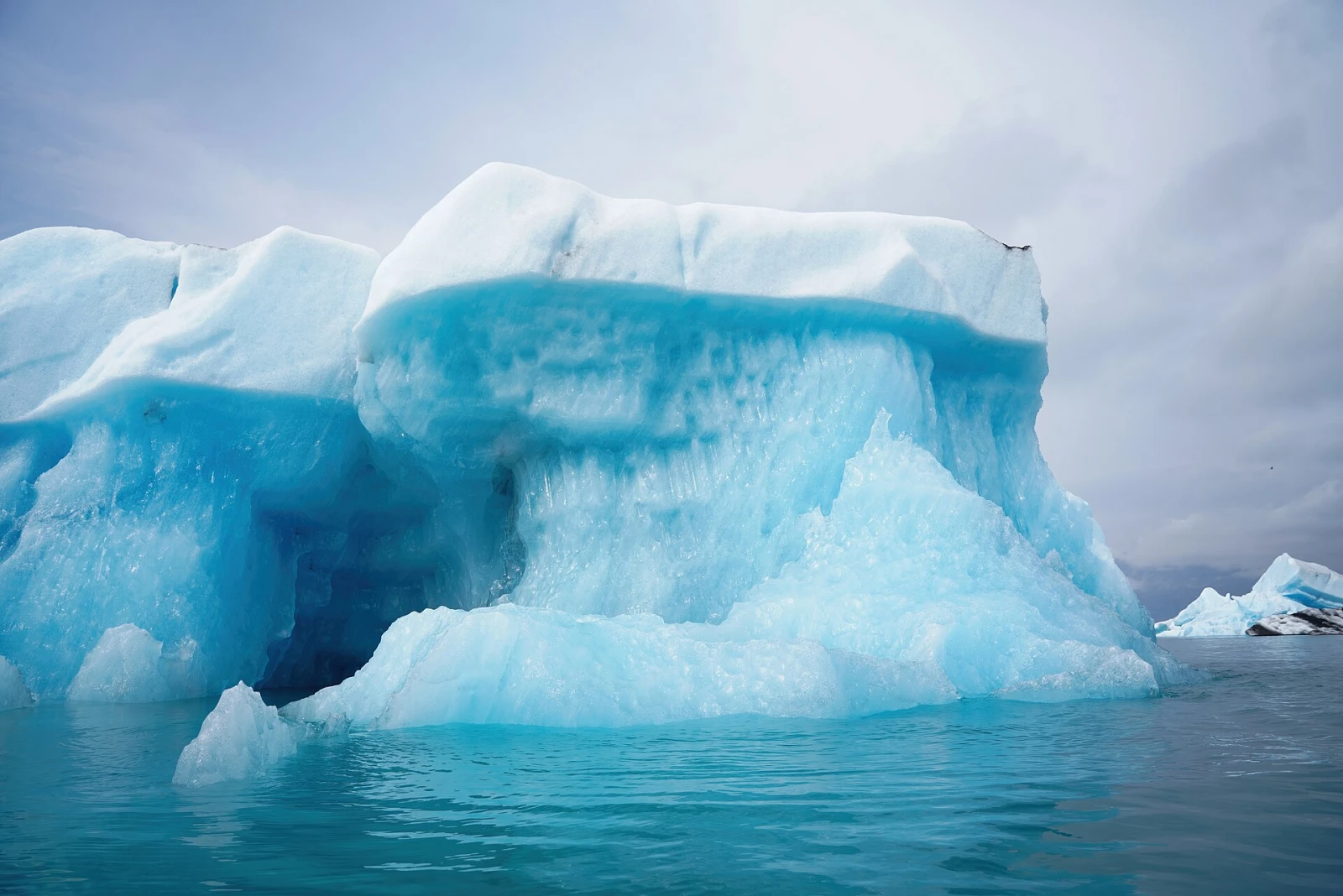 A freshly turned blue iceberg floating in Iceland's Jökulsárlón glacier lagoon.