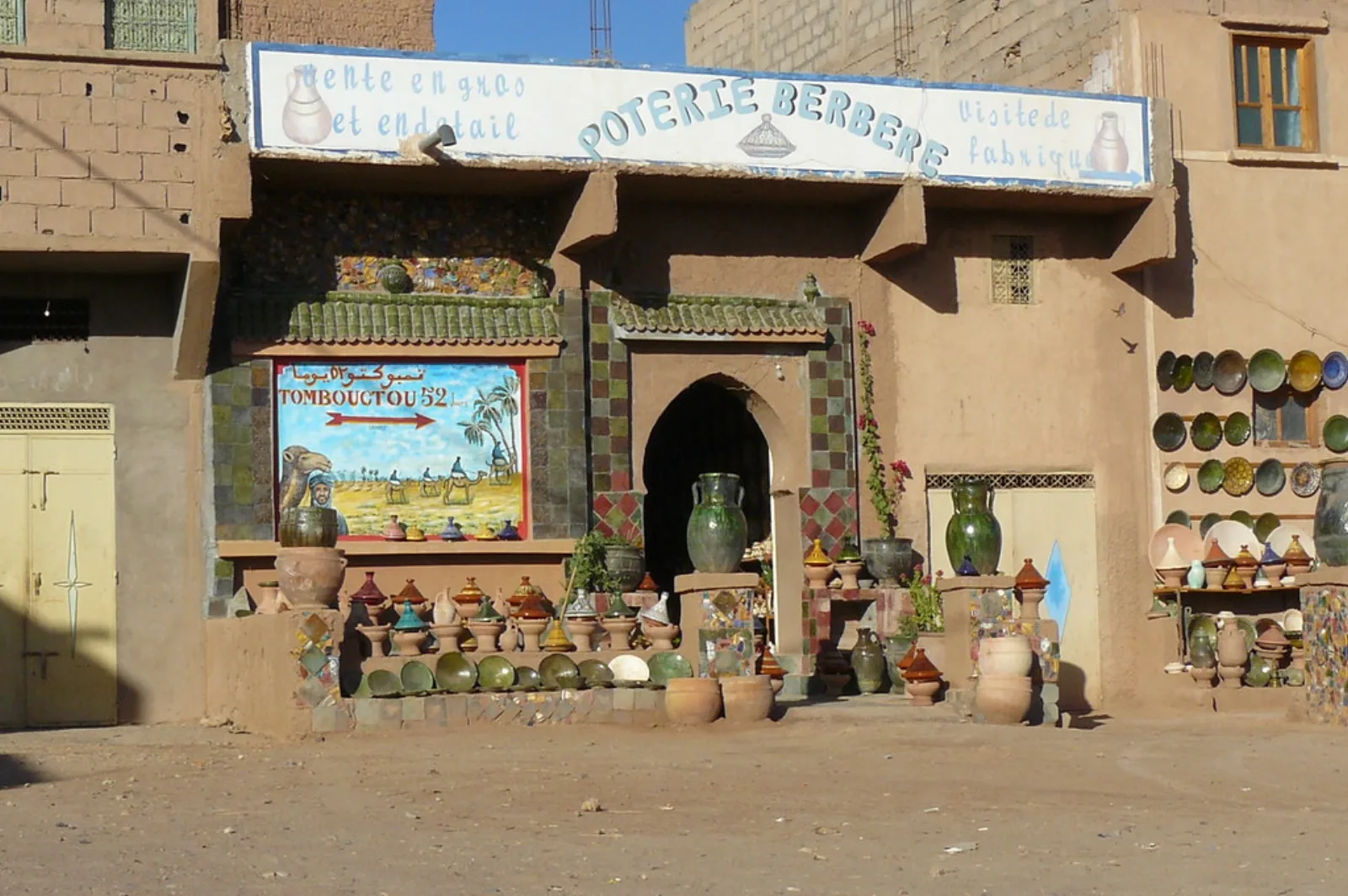 Green-glazed pottery displayed outside a workshop in Tamegroute, Morocco