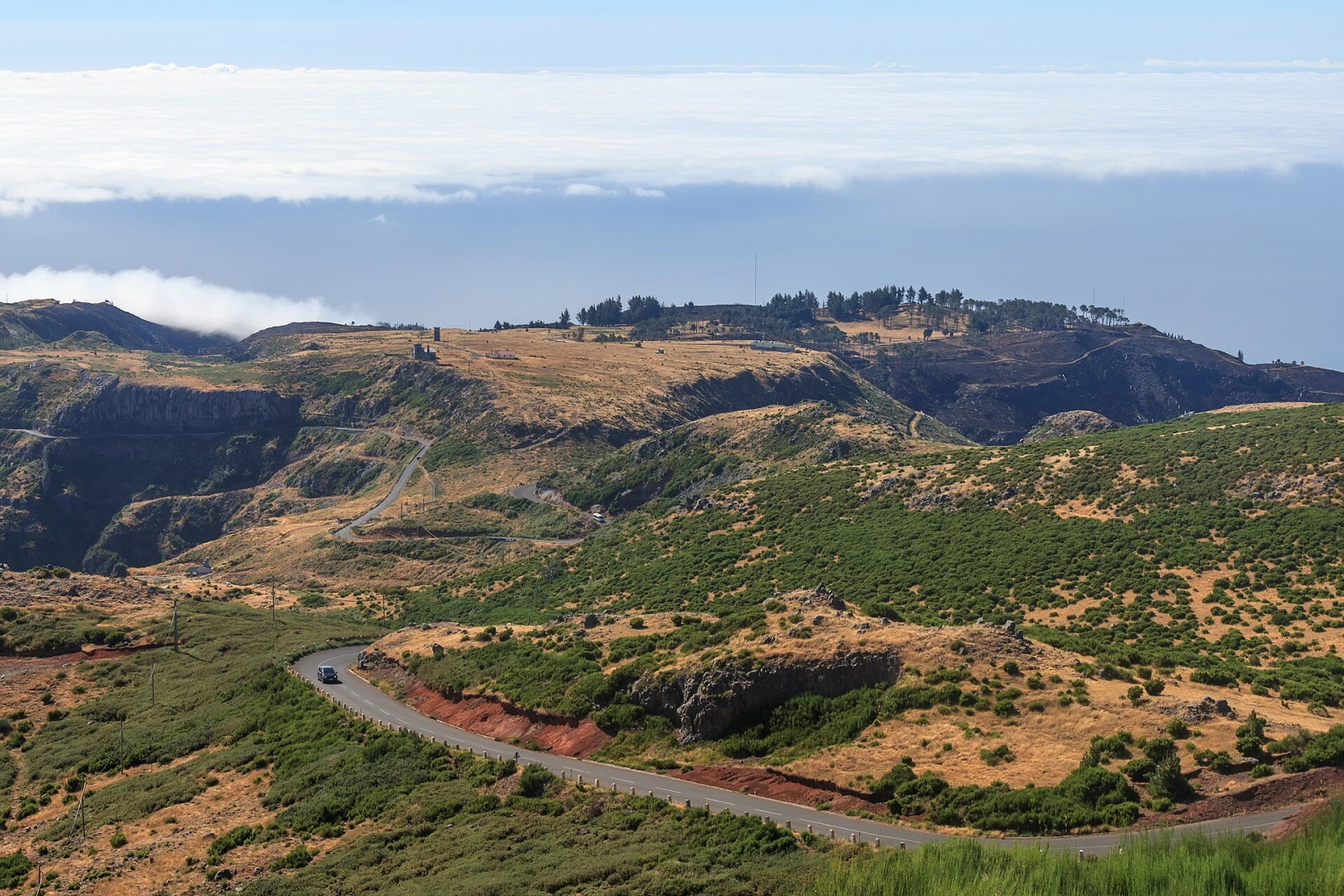 A high path and rugged volcanic ridges near Pico do Areeiro in Madeira.