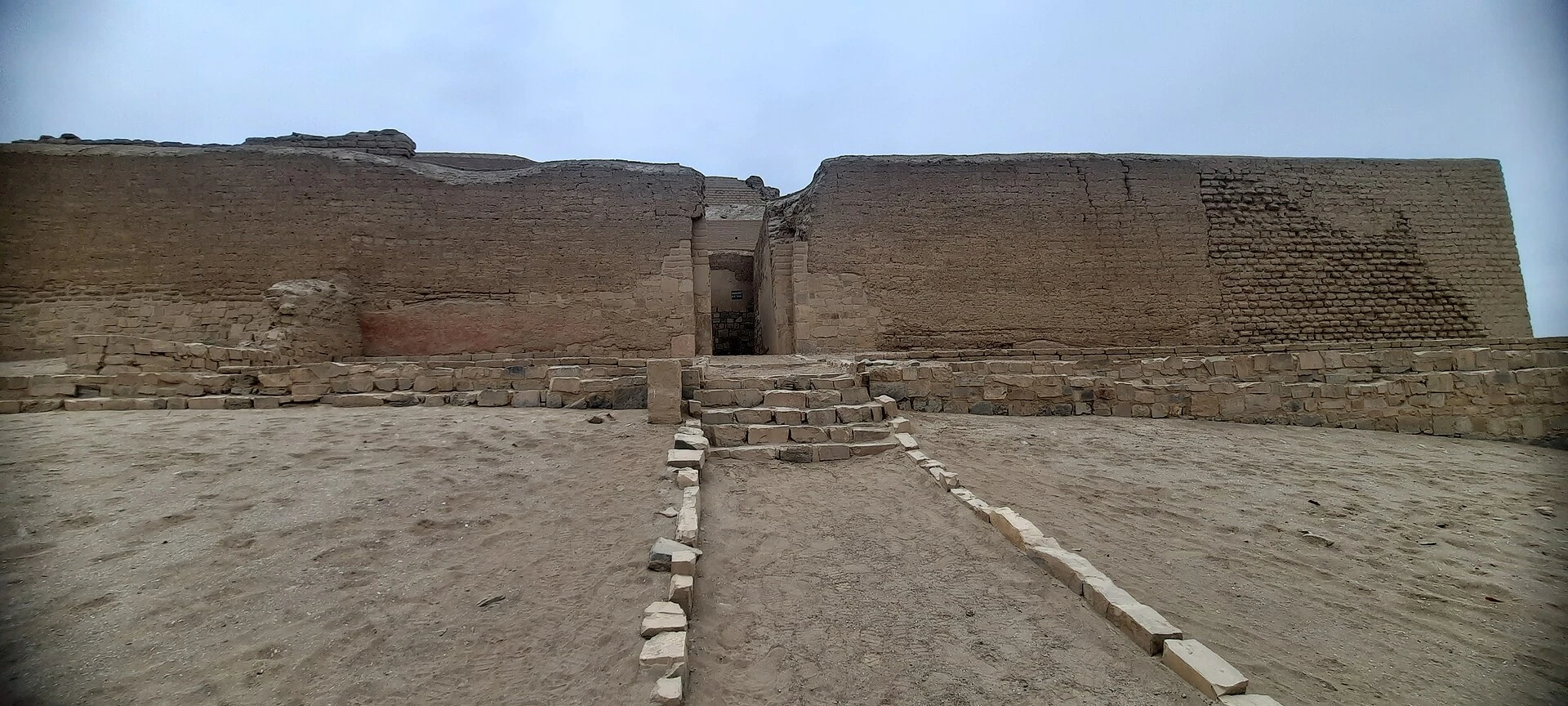 Wide desert view across the adobe temple complex of Pachacamac.