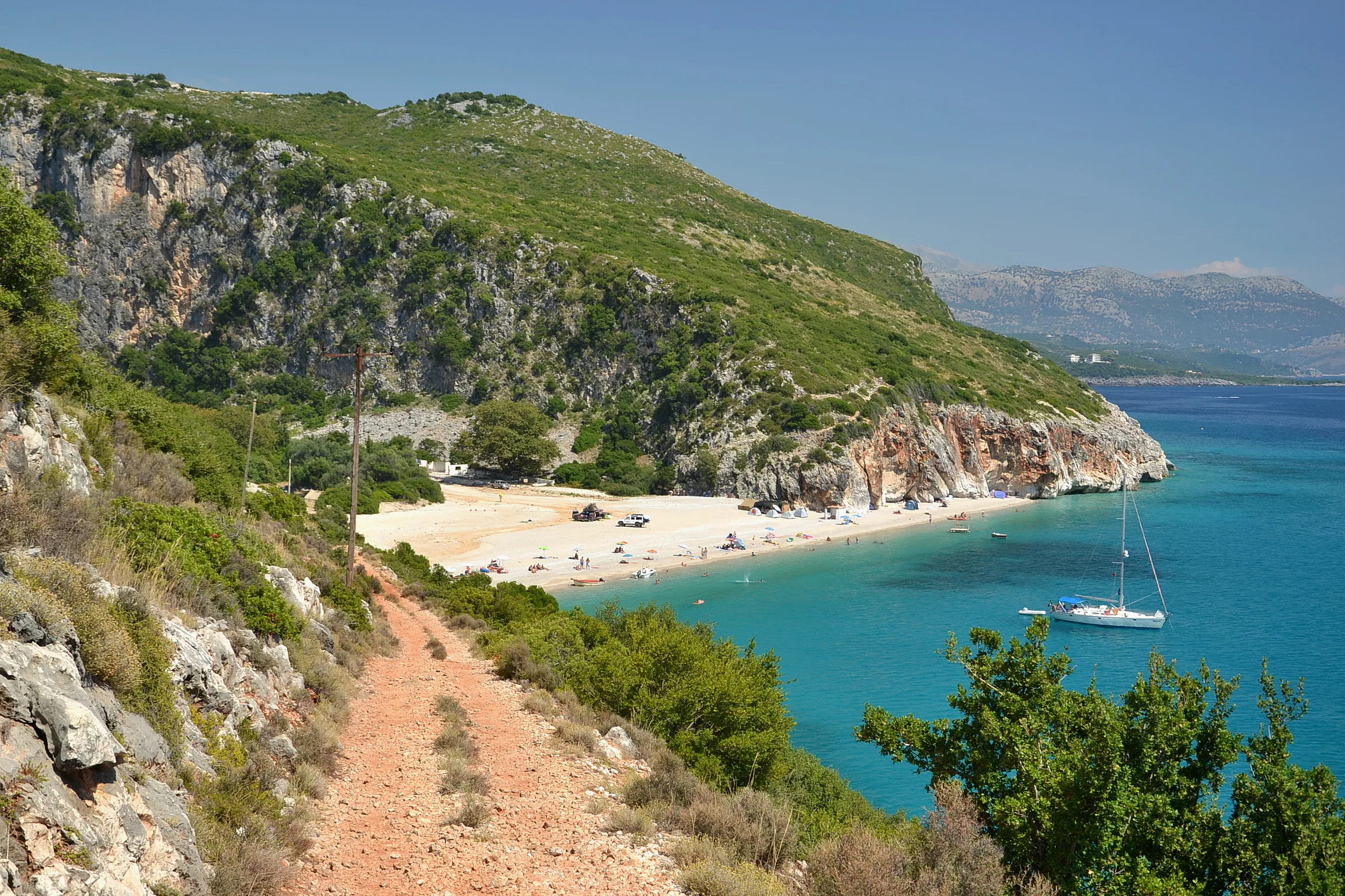 Gjipe Beach below its limestone cliffs and the coastal track in southern Albania.