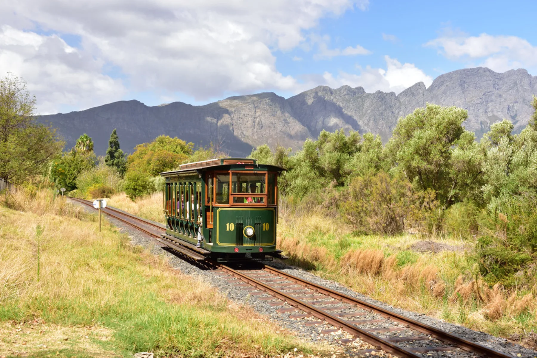 The Franschhoek Wine Tram passes through vineyards in South Africa’s Western Cape.