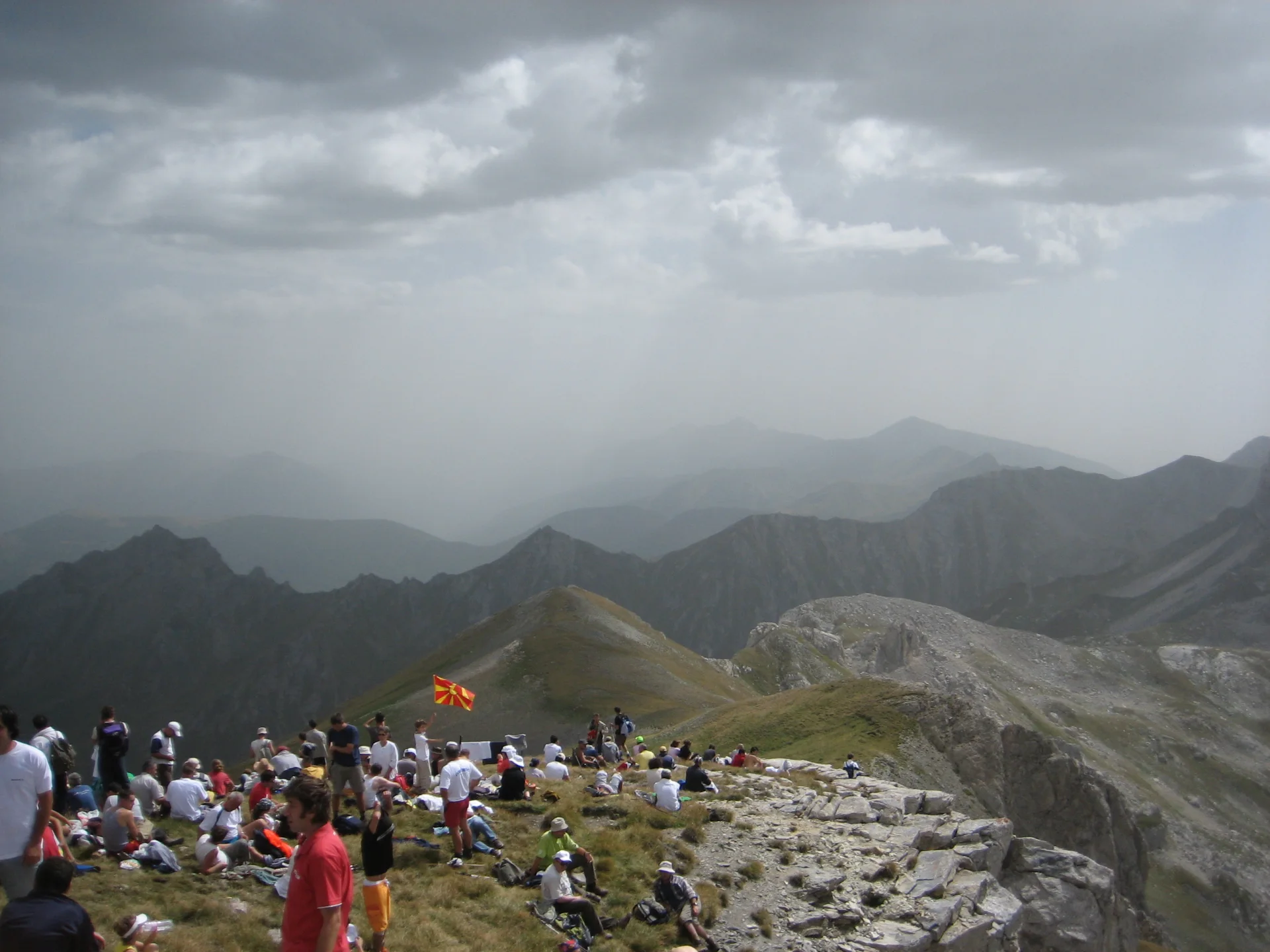 Walkers gathered on the rocky summit ridge of Mount Korab.