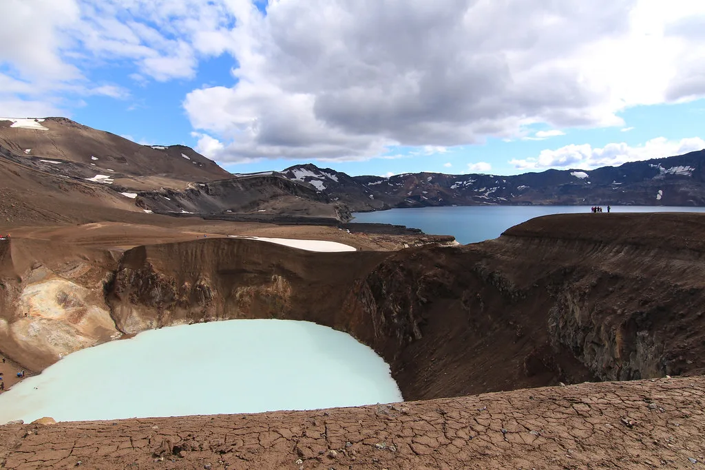 The pale blue geothermal lake in Víti crater beside Askja's volcanic terrain.