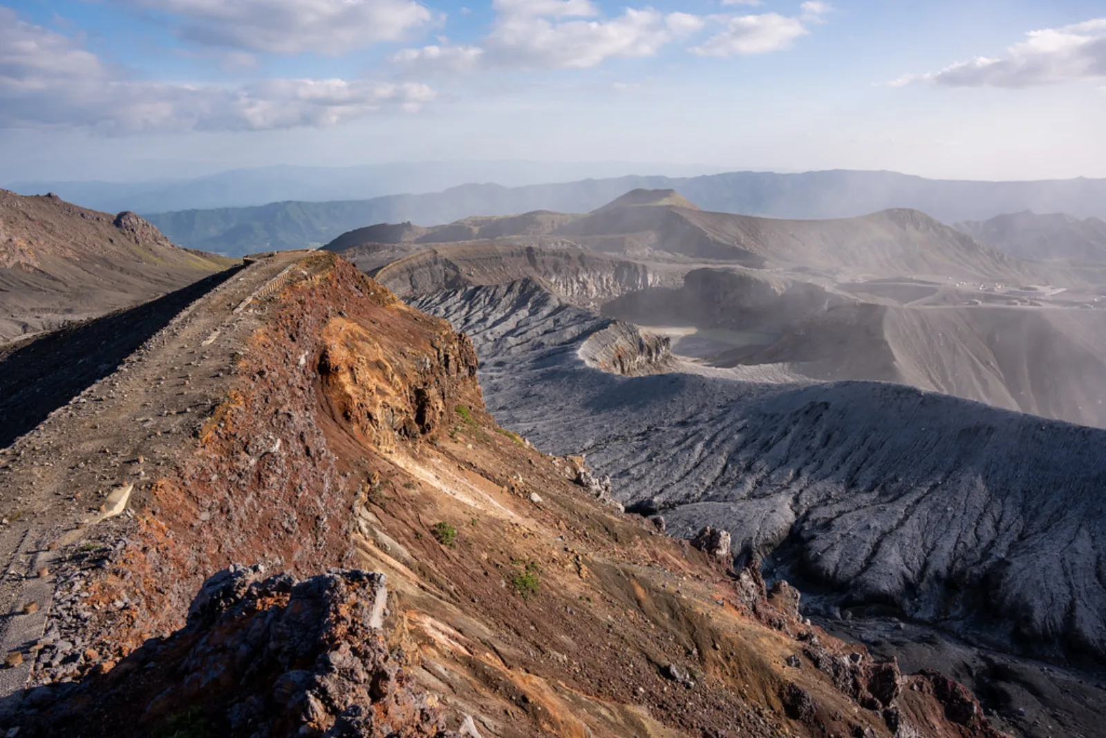 A permitted path crosses Mount Aso’s volcanic landscape.