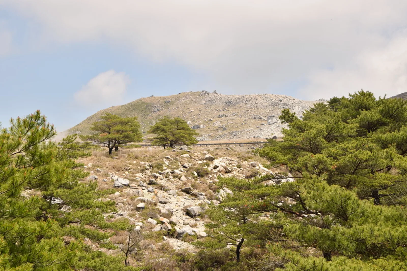 A mountain path crosses the volcanic Kirishima range.