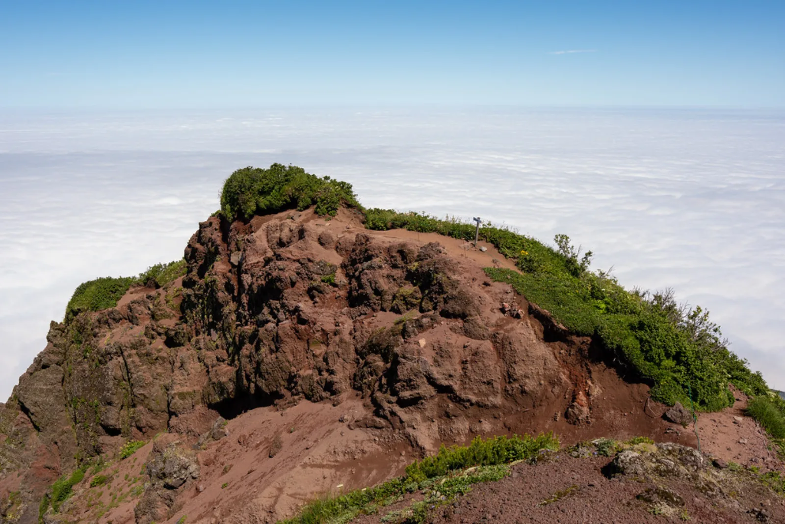 A rocky trail above the clouds on Mount Rishiri.