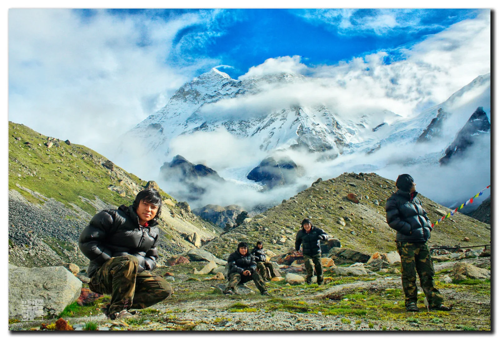 Trekkers at Makalu Base Camp beneath the mountain.