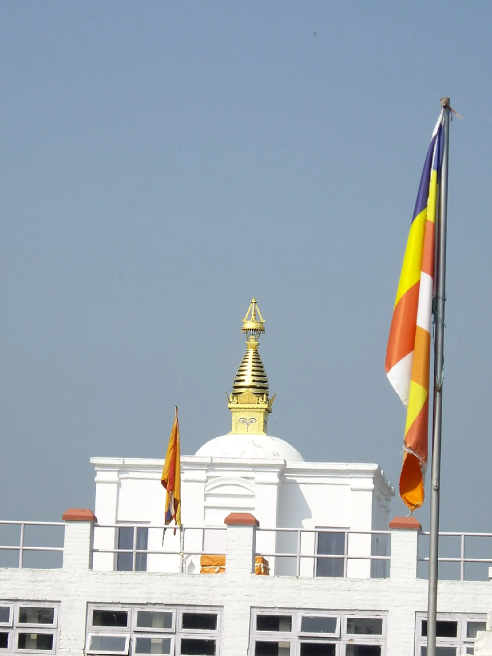 The white shrine and flags of Maya Devi Temple in Lumbini.