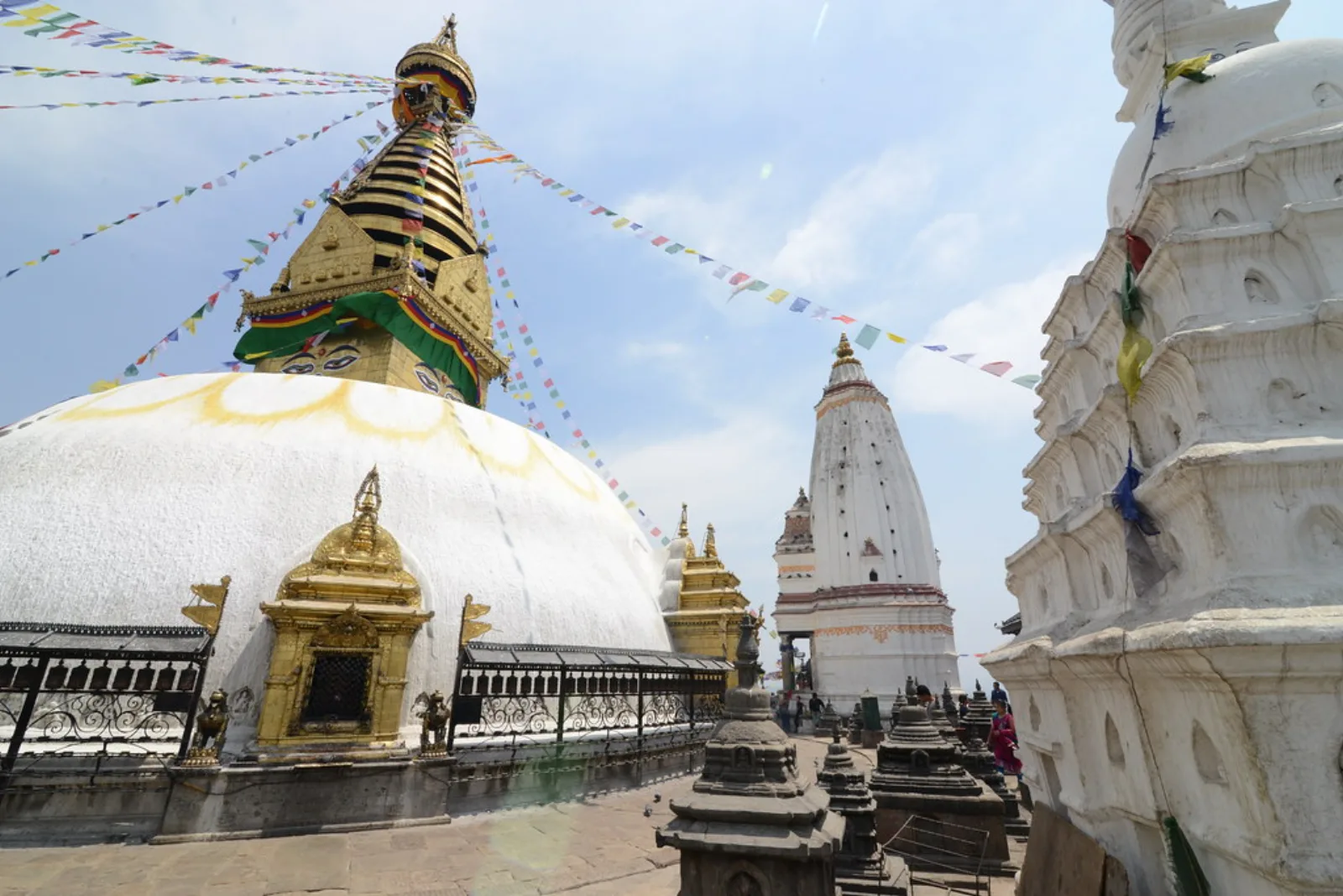 The large white dome and golden spire of Swayambhunath Stupa.