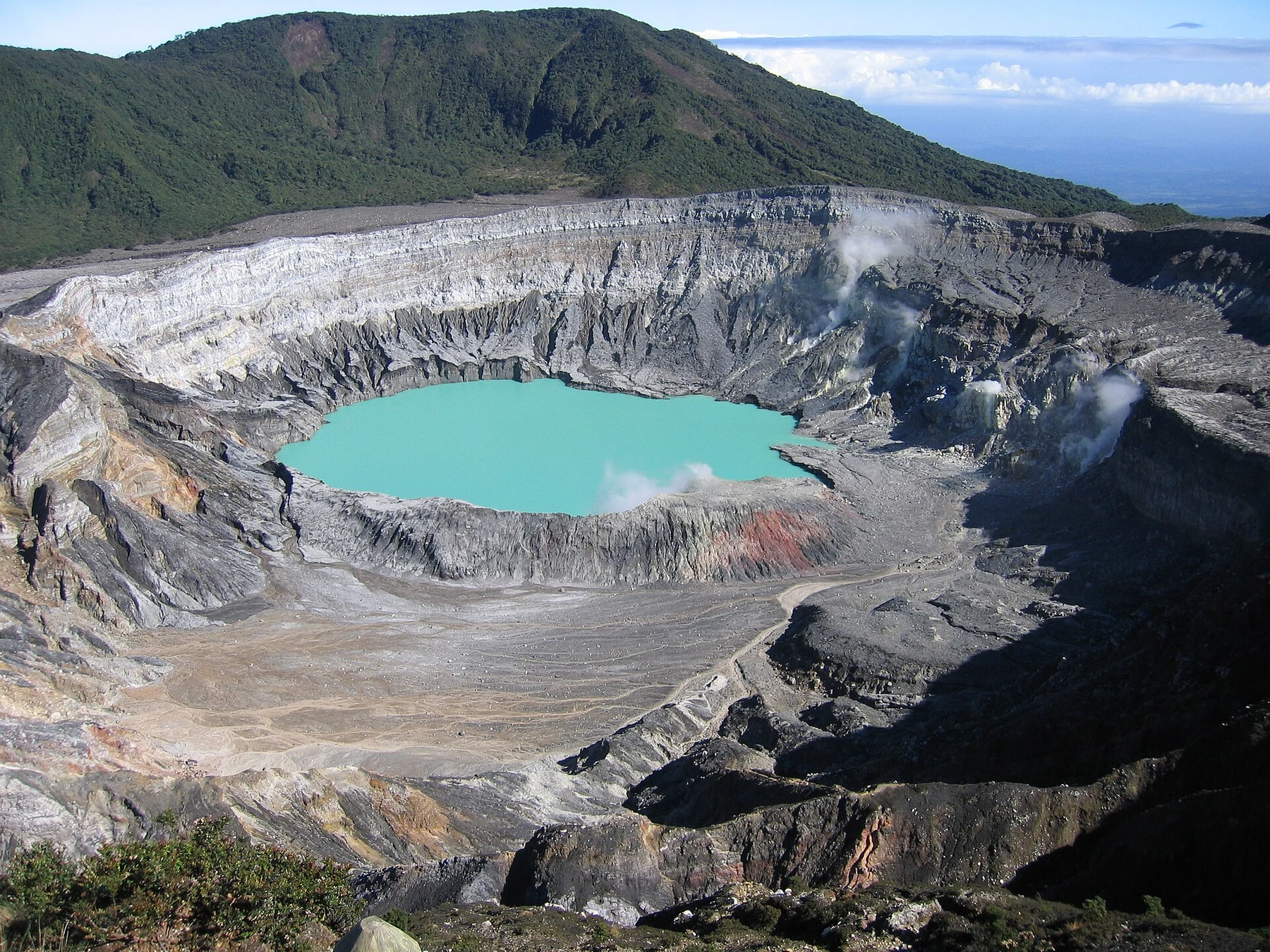 The crater lake and steep walls of Poás Volcano in Costa Rica.
